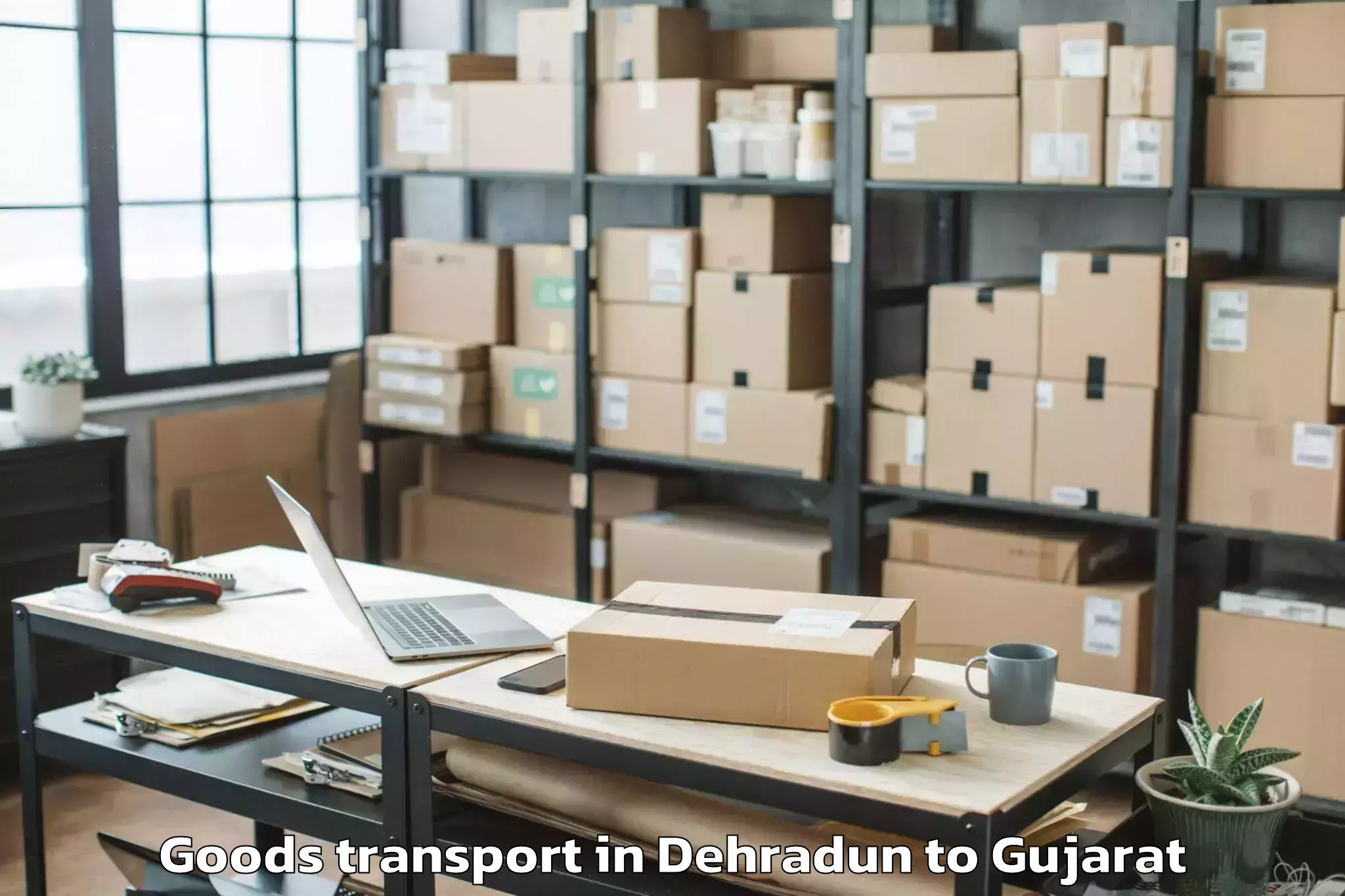 Book Dehradun to Vaghodia Ina Goods Transport